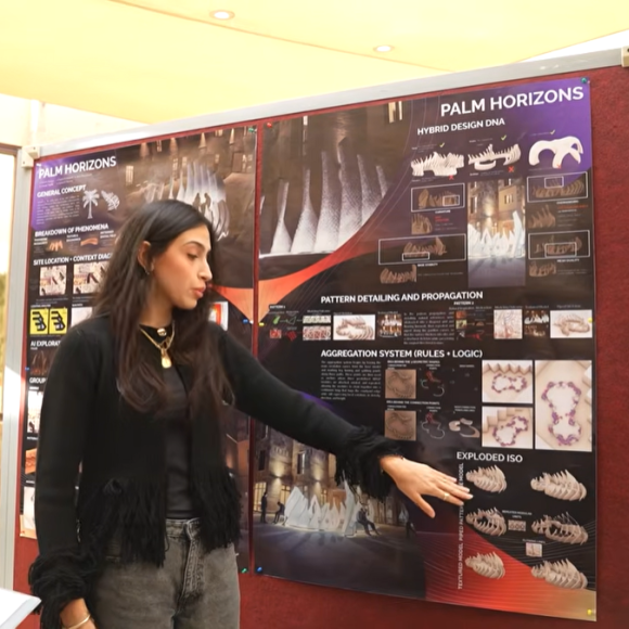 A female is standing in front of a board and pointing at it