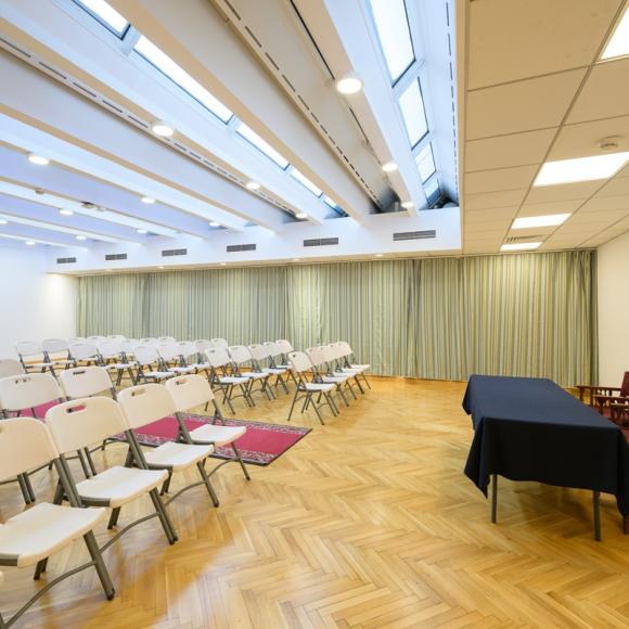 A room that has chairs in theater-style